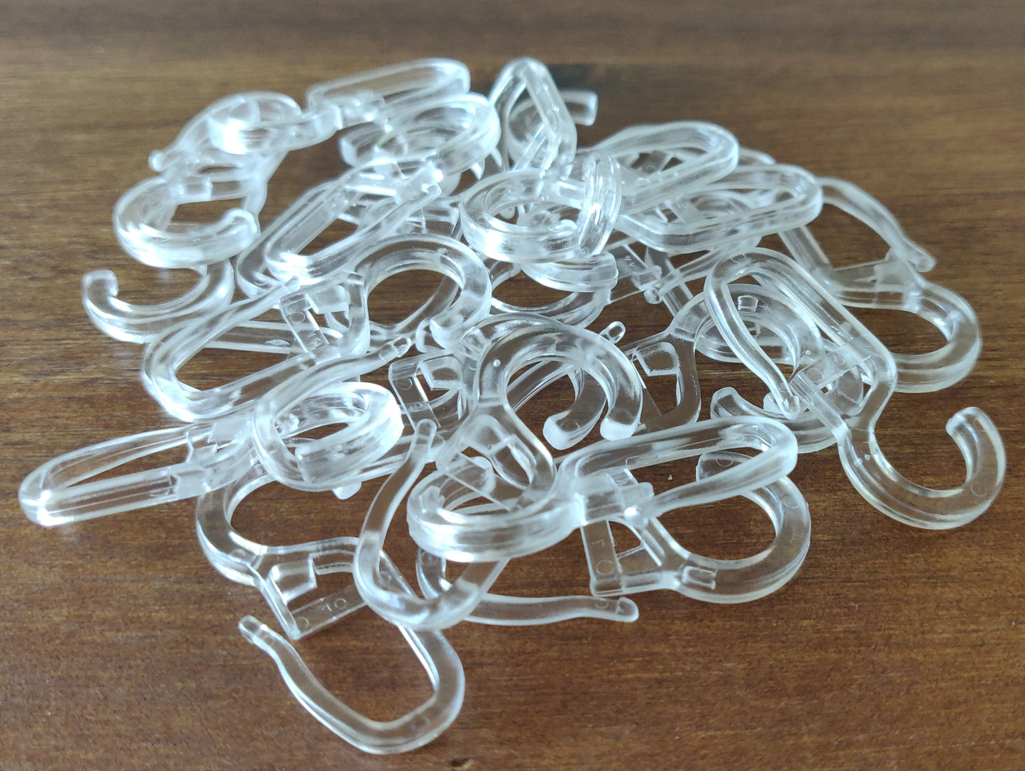 100 Überklipshaken 10mm glasklar - Faltenlegehaken für Gardinenringe